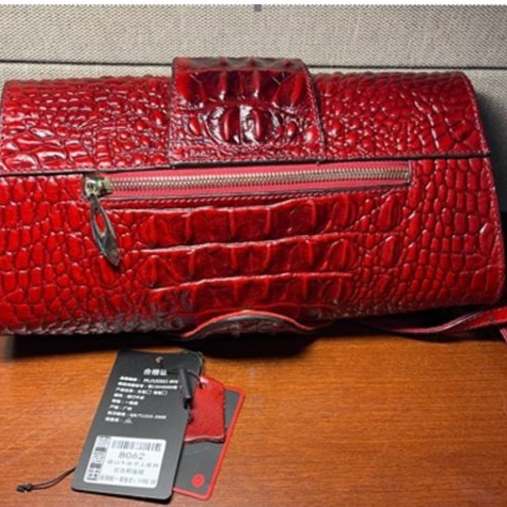 Pijushi brand new croc clutch.
